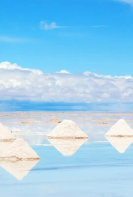 man harvesting salt at salar de uyuni