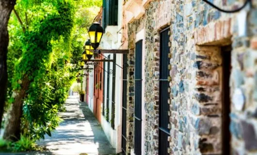 Yellow lamps on wall of historic district