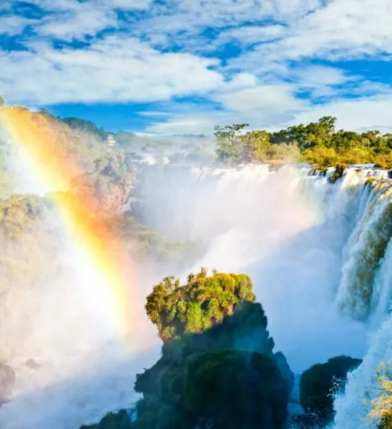 Rainbow over waterfall in South America