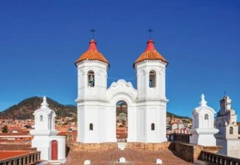 Two white bell towers seen in Sucre Bolivia on a tour of Bolivia