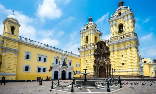 Fountain plaza near yellow building in Lima, Peru
