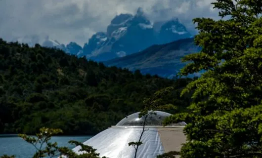 View of mountain lake over top of yurt
