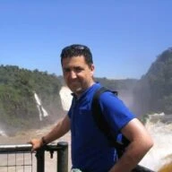 portrait of blake in front of a waterfall