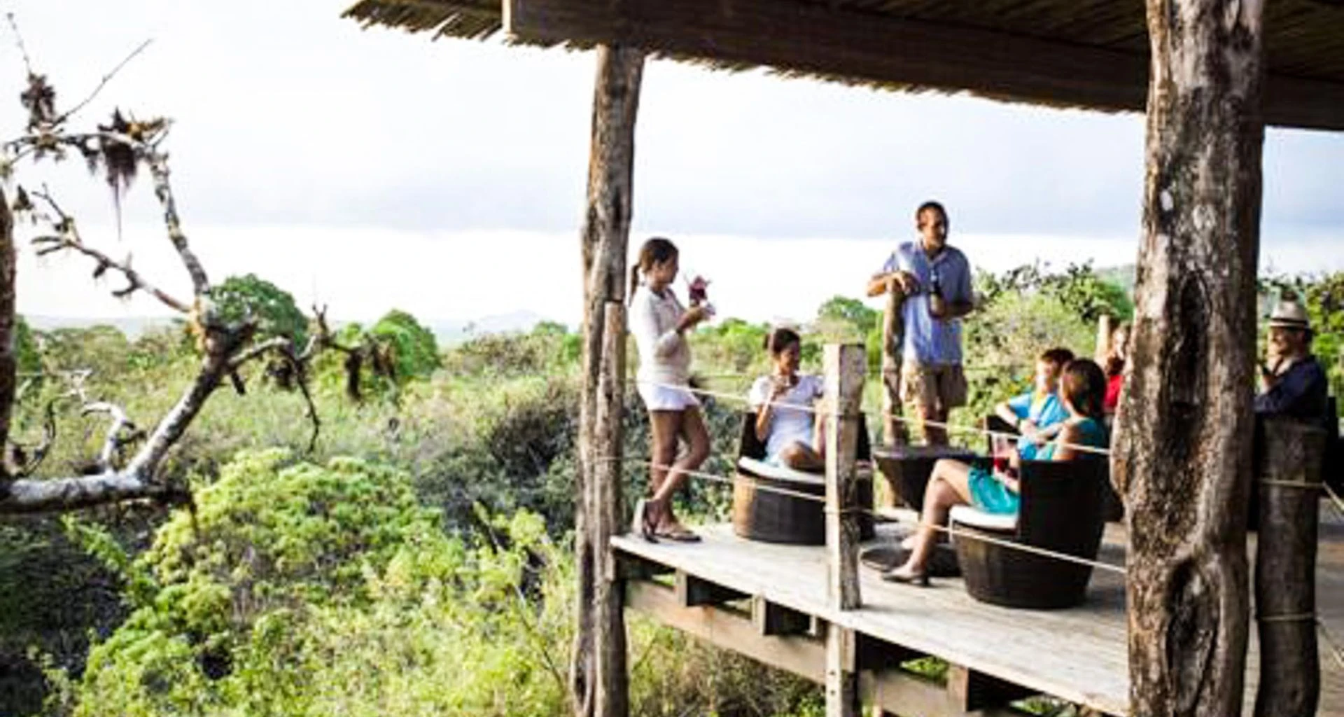 Group of people sits on Galapagos porch
