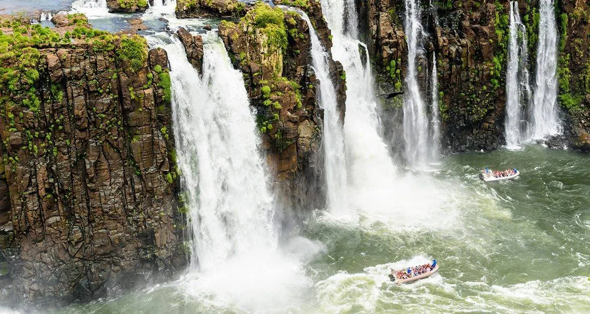 people-in-boat-approaching-iguazu-falls