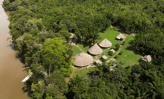 beautiful aerial view over riverside thatch resort in Guyana