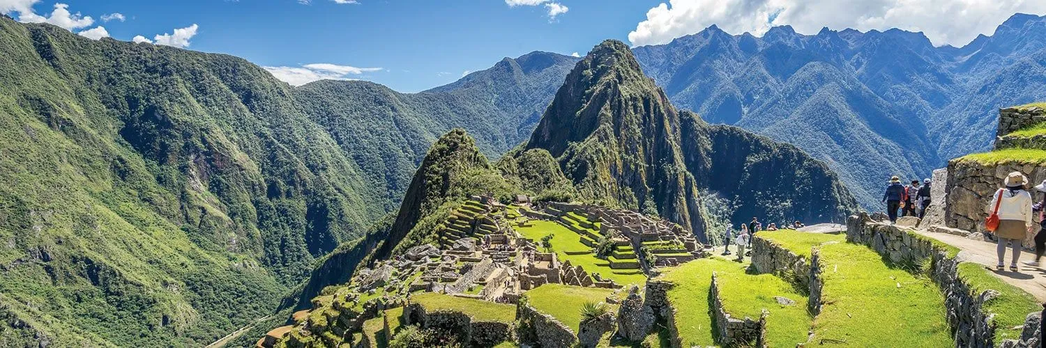 tourists visiting machu picchu peru on a sunny day