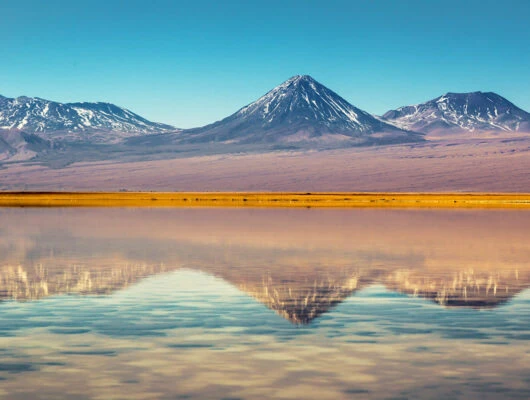 Mountains reflection on lake in Atacama Desert