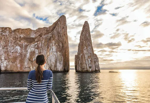 woman looking at the kicker rock in the galapagos