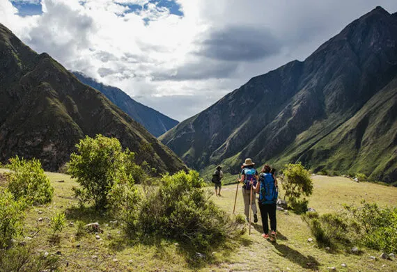travelers taking the inca trail to machu picchu