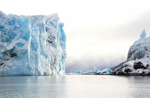 perito moreno glacier and water on foggy day