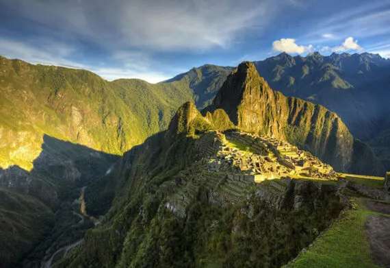 the sunrise over machu picchu mountain