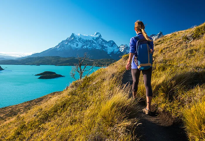 woman hiking in torres del paine chile patagonia