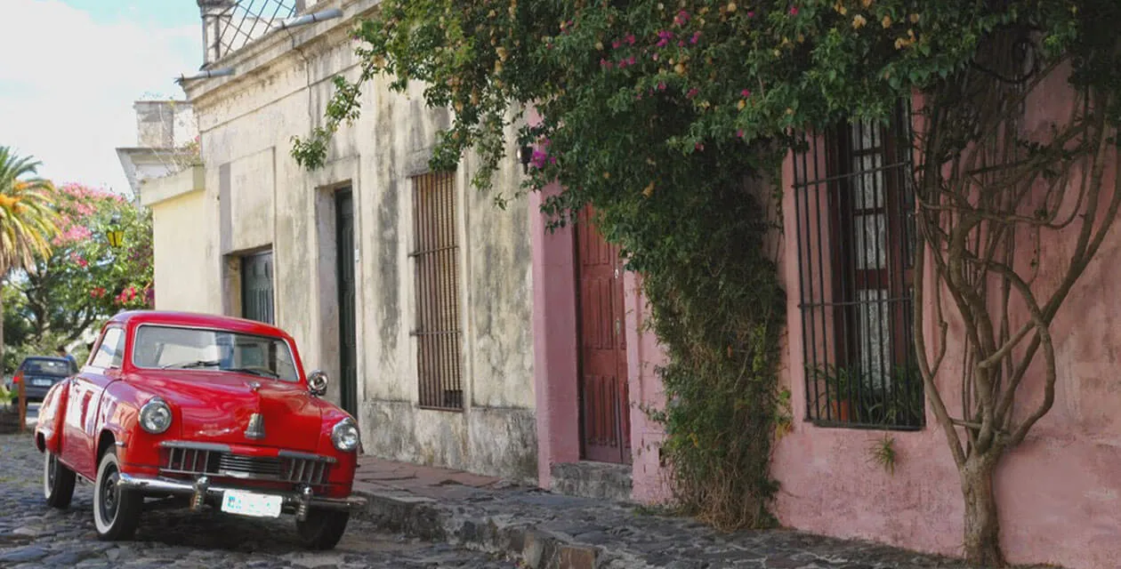 old vintage car on historic road in Colonia