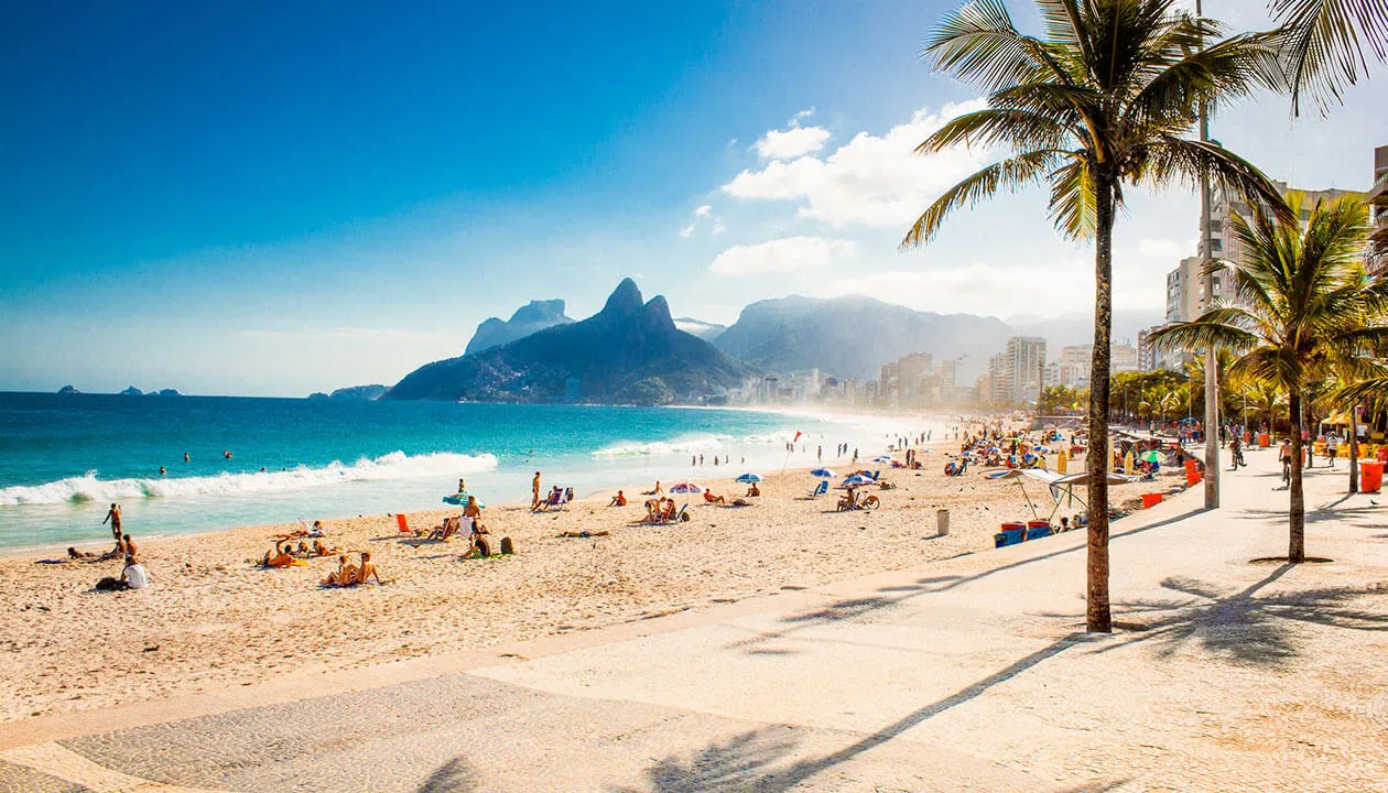 ipanema beach with beach goers and palm trees