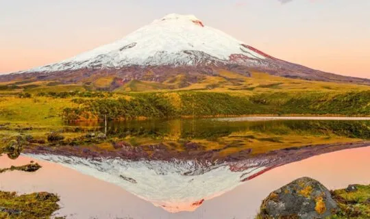 sun setting on cotopaxi volcano in ecuador