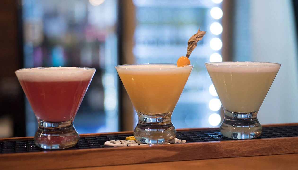 three different flavors of pisco sour cocktail