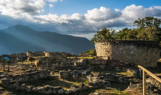 sun shining down on the kuelap ruins in peru