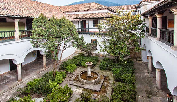 Colonial style home with courtyard