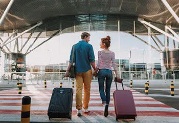Couple walking to the airport