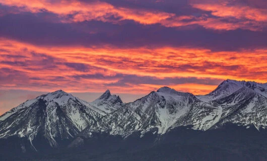 sunset over the mountains in ushuaia