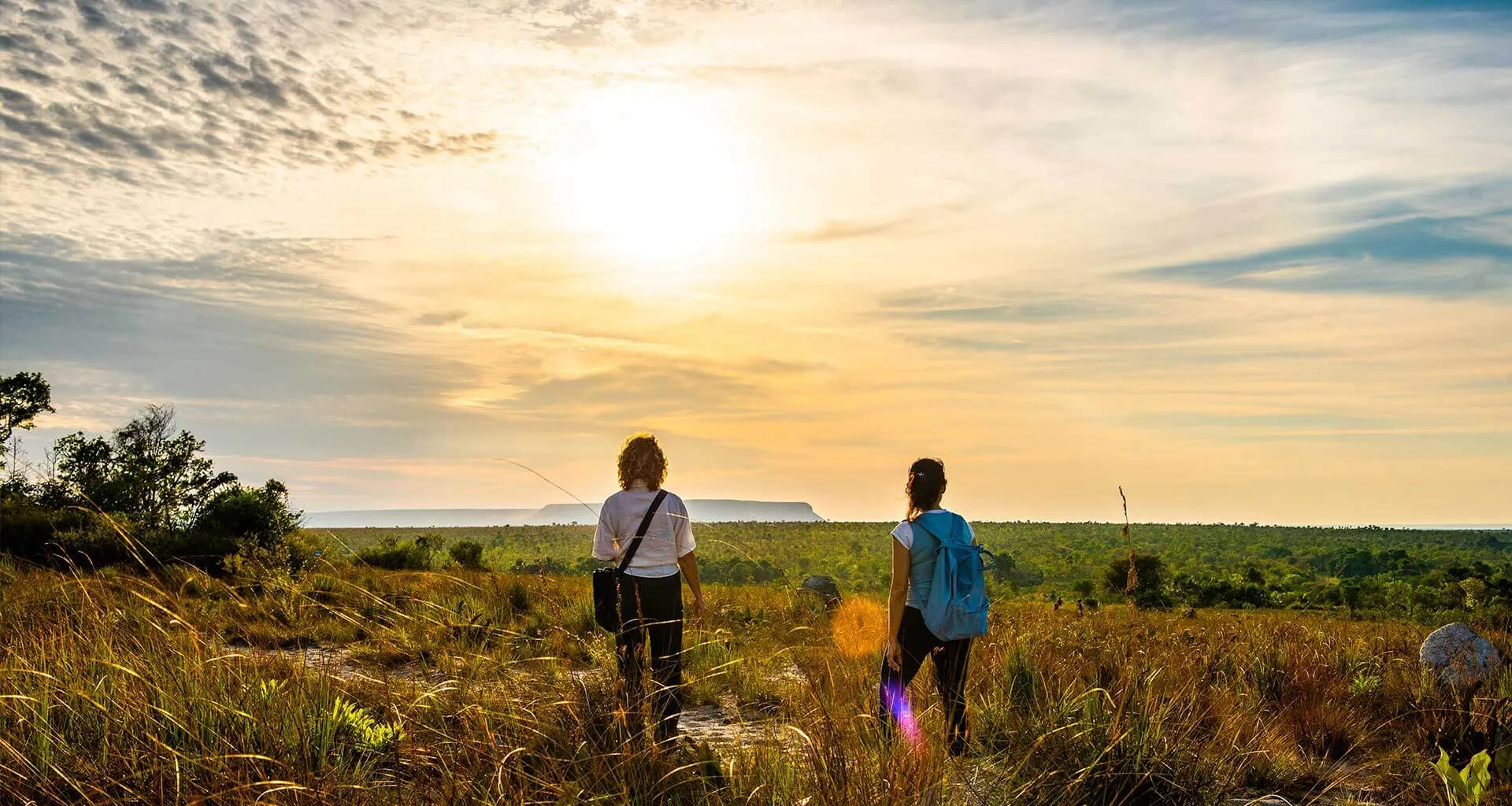 two people walking in the savannah in Brazil