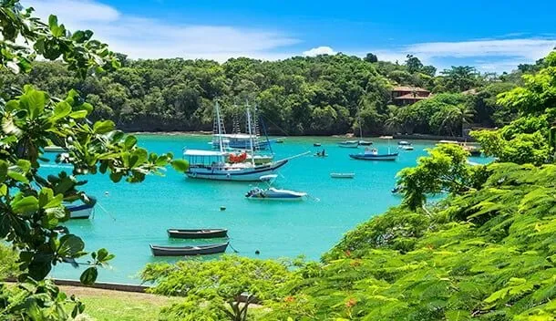 boat sitting in bright blue lagoon in ilha grande