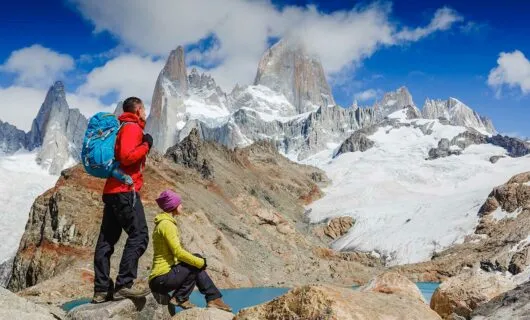 couple hiking in patagonia on a sunny day